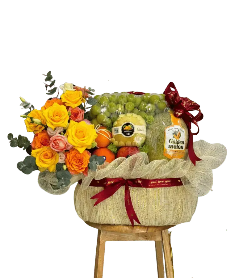 Giỏ trái cây Golden Melon, nho, cam phối hoa hồng vàng cam nơ đỏ đô