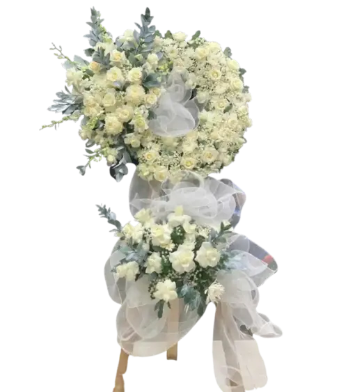 Kệ hoa chia buồn hồng kem cúc trắng và hoa baby