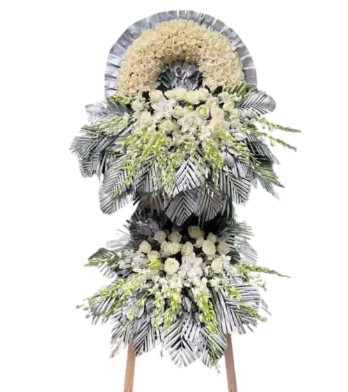 Kệ hoa chia buồn hồng kem hồng trắng và lá bạc