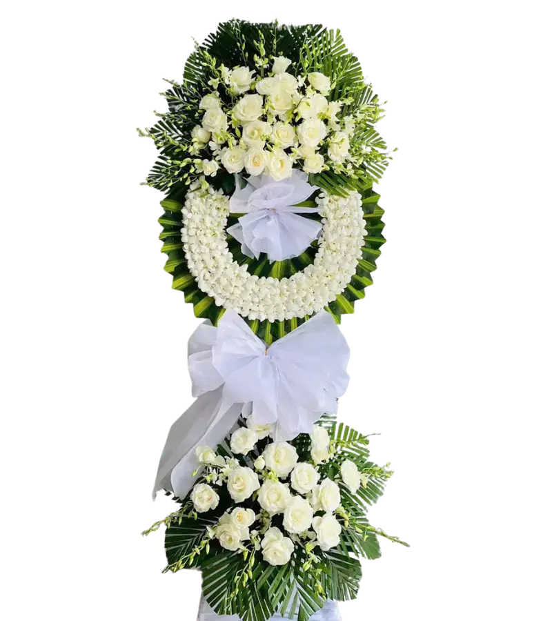 Kệ hoa chia buồn hồng kem kết vòng tròn nơ trắng
